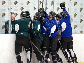 Several members of the London Knights succeed in making forward Max Jones laugh during a media interview before practice at the Western Fair Sports Centre on Wednesday. (Craig Glover/The London Free Press)