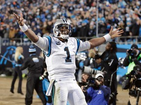 Carolina Panthers' Cam Newton celebrates a touchdown pass during the second half the NFL football NFC Championship game against the Arizona Cardinals Sunday, Jan. 24, 2016, in Charlotte, N.C. (AP Photo/Chuck Burton)