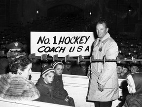 In this Feb. 29, 1960 file photo, U.S. Olympic Hockey coach Jack Riley is welcomed back to U.S. Military Academy at West Point, N.Y.  Riley, a former Army hockey coach who won guided the U.S. team to its first Olympic gold medal in 1960, has died. He was 95. The U.S. Military Academy announced in a statement that Riley died Wednesday, Feb. 3, 2016 in Massachusetts. No cause of death was provided. (AP Photo/File)