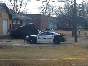 A Hamilton Police cruiser parked in a driveway where a man was shot and killed early in the morning of Feb. 4, 2016. (Terry Davidson/Toronto Sun)