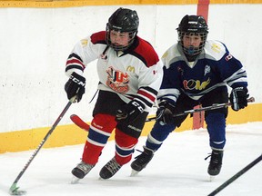 Garet Vandendool of the Wallaceburg Atom Tri-County team brings the puck down the ice while a South Kent player tries to keep up during a game played at Wallaceburg Memorial Arena on Jan. 30. The Atoms tied the game 2-2, thanks to two late goals from Brayden Burm. In 24 games this season the Wallaceburg Atom Tri-County team has not lost a game, as they have a 22-0-2 record.