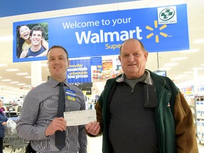 Brandon Guthro, on the left, store manager at Walmart Tillsonburg, and Courtland Lions' Henry Puhr  recently announced a donation to Camp Trillium.