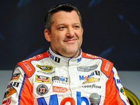After fracturing his back in an accident on an all-terrain vehicle, Tony Stewart is out for the start of the NASCAR season. (Mike McCarn/AP Photo)