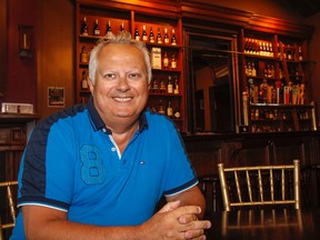 Local restaurateur Paul Fortier at one of his establishments, Sir John's Public House on King Street. (Julia McKay/The Whig-Standard)