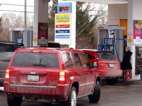 Commuters had a nice surprise on their drive home as gas went below 70 cents per litre including the Esso station at Baseline and Pinecrest Rds where gas was 69.6 cents per litre Thursday February 04, 2016. (Darren Brown)