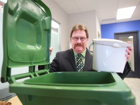 Randy Park, supervisor of Waste Diversion for the City of Winnipeg, displays some the city's organic waste bins in Winnipeg, Man. Thursday Feb. 4, 2016.