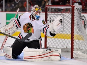 Chicago Blackhawks goalie Michael Leighton makes a save during the team’s Training Camp Festival in Chicago, Monday, Sept. 22, 2014. (THE CANADIAN PRESS/AP/Paul Beaty)