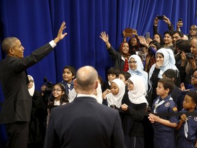 U.S. President Barack Obama waves farewell to students after his remarks at the Islamic Society of Baltimore mosque in Catonsville, Maryland on February 3, 2016. REUTERS/Jonathan Ernst