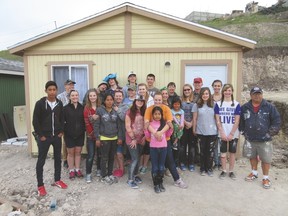 Brant Christian School students, chaperones and the house recipients pose outside the finished home. Submitted photo