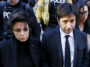 Jian Ghomeshi, a former celebrity radio host who has been charged with multiple counts of sexual assault, leaves the courthouse after the first day of his trial alongside his lawyer Marie Henein (L), in Toronto on February 1, 2016. REUTERS/Mark Blinch