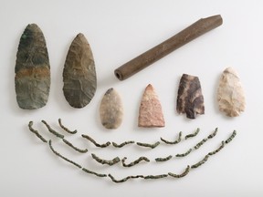 Several arrowheads and fragments of a necklace made of leather and native copper are shown in this undated handout photo. The Pointe-a-Calliere museum says its new show "Fragments of Humanity," opening Feb. 13, is the first major exhibition dedicated entirely to Quebec archeology. THE CANADIAN PRESS/HO - Laboratoire et Reserve d'archeologie du Quebec, MCC - Jacques Beardshell