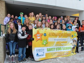 Student members of the Youth Action Team (YAT) from Evergreen Elementary School received a Safety Star school grant from FortisAlberta. A cheque worth $2,500 was presented to Evergreen Elementary School for YAT’s “buddy bench” initiative. The cheque presentation was attended by Wild Rose School Division chairperson Mae Tyron, Aim for Success coordinators Christopher Lees and Shelley Chaney, FortisAlberta Stakeholder Relations Manager Nicole Smith, and FortisAlberta Area Coordinator for Drayton Valley Randall Rideout.