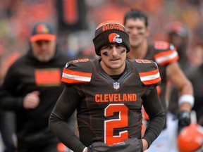 In this Dec. 6, 2015, file photo, Cleveland Browns quarterback Johnny Manziel walks off the field at halftime of an NFL football game against the Cincinnati Bengals in Cleveland. (AP Photo/David Richard, File)