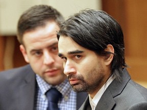 Derek Medina looks at the prosecuting attorney as he speaks on the fourth day of his murder trial at Miami Criminal courts on Monday, Nov. 16, 2015 in Miami. (C.M. Guerrero/El Nuevo Herald via AP, Pool)