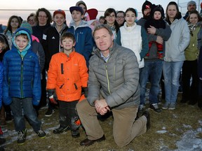 SHERWOOD PARK, ALBERTA: FEBRUARY 4, 2016 - Scott Milligan (kneeling) and some Sherwood Park, Alberta residents say they don't want to lose their local park to a new school, planned to open in Davidson Creek Park in 2018. The school division says the land has always been zoned as a potential future school site. (PHOTO BY LARRY WONG/POSTMEDIA)