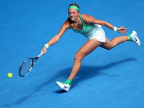 Victoria Azarenka of Belarus makes a forehand return to Angelique Kerber of Germany during their quarterfinal match at the Australian Open in Melbourne on Jan. 27, 2016. Azarenka will not play for Belarus this weekend when the country faces Canada at the Fed Cup in Quebec City. (Rick Rycroft/AP Photo)