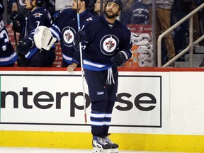 Winnipeg Jets defenceman Dustin Byfuglien (33) looks up at the scoreboard replay after he scores against the Dallas Stars during the third period at MTS Centre.