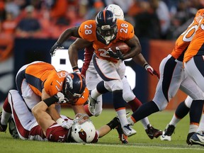 Running back Montee Ball of the Denver Broncos carries the ball against the Arizona Cardinals during pre-season action at Sports Authority Field at Mile High in Denver on Sept. 3, 2015. (Doug Pensinger/Getty Images/AFP)