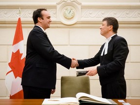 Kingston and the Islands Member of Parliament Mark Gerretsen, left, is congratulated by Andre Gagnon, deputy clerk of the House of Commons (Acting) after being sworn in on Thursday November 12 2015. Submitted Photo /The Whig-Standard/Postmedia Network