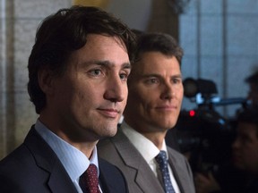 Prime Minister Justin Trudeau and Vancouver Mayor Gregor Robertson take part in a news conference in the Foyer of the House of Commons on Parliament Hill in Ottawa Friday, February 5, 2016. (THE CANADIAN PRESS/Adrian Wyld)