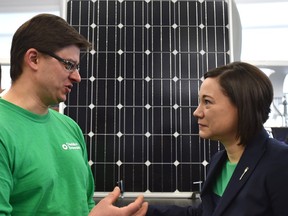 EDMONTON, ALTA: FEBRUARY 5, 2016 -- Shannon Phillips, Alberta Minister of Environment and Parks speaks with Mikhail Ivanchikov of Dandelion Renewables after announcing a renewable solar energy funding as part of its actions under the Climate Leadership Plan at the NAIT Centre for Sustainable Energy Technologies in Edmonton, February 5, 2016. ED KAISER/POSTMEDIA NETWORK