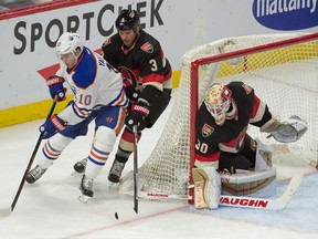 Senators defenceman Marc Methot keeps close tabs on Edmonton Oilers winger Nail Yakupov on Thursday night at the Canadian Tire Centre. (USA Today Sports)