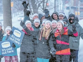 Submitted Photo
Participants in the 2015 Coldest Night of the Year strike a pose during a heavy snowfall. The annual walk benefits Nightlight Belleville's drop-in centre in the downtown core.