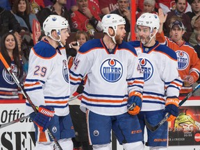 Edmonton Oilers forward Zack Kassian celebrates scoring a goal against the Ottawa Senators with teammates Leon Draisaitl, left, and Teddy Purcell, right, at Ottawa's Canadian Tire Centre on Thursday.  (Andre Ringuette, Getty Images)