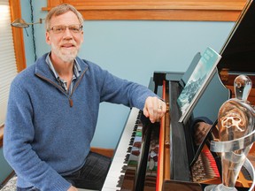 John Burge, seen here in his home in Kingston, is a professor at Queen's University in the School of Drama and Music and has been nominated for his second Juno award. (Julia McKay/The Whig-Standard)