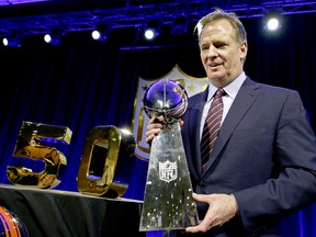 NFL commissioner Roger Goodell poses with the Lombardi Trophy after a news conference Friday, Feb. 5, 2016, in San Francisco. (Charlie Riedel/AP Photo)