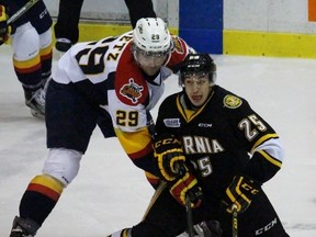 Jordan Kyrou of the Sarnia Sting protects the puck from Erie Otters forward Nick Betz during the Ontario Hockey League game at the Sarnia Sports and Entertainment Centre on Friday, Feb. 5, 2016 in Sarnia, Ont. The teams played for the fourth and final time this season. (Terry Bridge, The Observer)