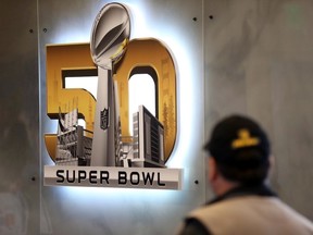 A man walks past a Super Bowl 50 logo in advance of the game Friday in San Francisco. (Cary Edmondson/USA TODAY Sports)