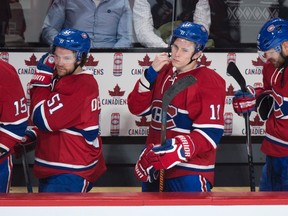 Montreal Canadiens (from left) David Desharnais, Brendan Gallagher and Andrei Markov leave the bench following their 5-2 loss to the Columbus Blue Jackets in Montreal on Tuesday, Jan. 26, 2016. (THE CANADIAN PRESS/Paul Chiasson)