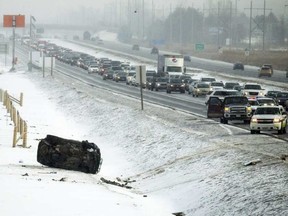 A single vehicle rollover caused traffic disruptions on the westbound 174 west of Jeanne d'Arc Blvd. (ASHLEY FRASER / POSTMEDIA)