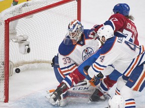 Montreal Canadiens defencemen Tom Gilbert (77) scores on Edmonton Oilers goaltender Anders Nilsson as Oilers' Zack Kassian (44) defends during third period NHL hockey action in Montreal, Saturday, February 6, 2016.