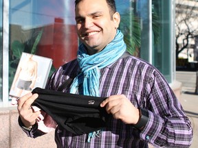 Shant Chakmakian, director of strategic partnerships with Junior Chamber International Edmonton, holds up a few donations on Feb. 6, 2016, ready for Undies4Youth, a JCI campaign to gather a thousand pairs of underwear to donate to underprivileged youth at Youth Empowerment and Support Services.