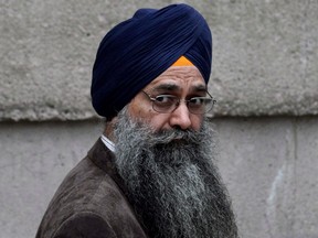 Inderjit Singh Reyat waits outside the B.C. Supreme Court, in Vancouver, on September 10, 2010. Reyat, the only person convicted in the 1985 Air India bombings, has been granted a statutory release from prison to a halfway house. THE CANADIAN PRESS/Darryl Dyck