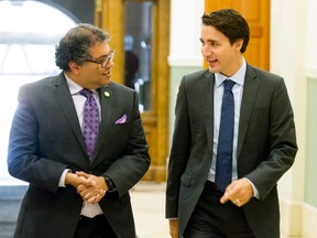 Prime Minister Justin Trudeau, seen here meeting with Calgary Mayor Naheed Nenshi on Sept. 16, 2015, shouldn't be a cheerleader for Energy East pipeline but he should be a cheerleader for what he believes will be his own rigorous, robust review process. Lyle Aspinall/Calgary Sun/Postmedia Network
