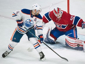 Montreal Canadiens goaltender Ben Scrivens makes a save as Edmonton Oilers' Taylor Hall looks for the rebound during first period NHL hockey action in Montreal, Saturday, February 6, 2016. THE CANADIAN PRESS/Graham Hughes