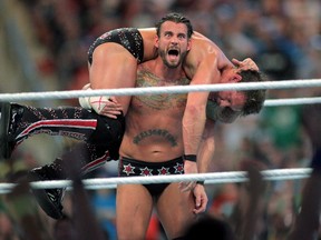 In this April 1, 2012, file photo, CM Punk competes against Chris Jericho at WrestleMania XXVIII in Sun Life Stadium in Miami Gardens, Fla. (THE CANADIAN PRESS/AP Images for Wreslemania, Marc Serota)