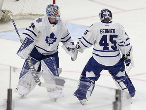 Leafs goalie James Reimer (left) gets taken out of the game during the first period against the Senators on Feb. 6. Replacing Reimer was Jonathan Bernier.  (Tony Caldwell, Ottawa Sun)