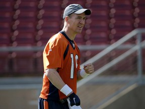 Denver Broncos quarterback Peyton Manning walks on the field during an NFL football practice in Stanford, Calif., Friday, Feb. 5, 2016. (AP Photo/Jeff Chiu)