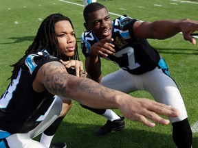 Carolina Panthers wide receiver Kelvin Benjamin, left, and wide receiver Devin Funchess pose for a photo inside Levi's Stadium as they gathered for a team photo in preparation for the Super Bowl 50 football game Friday Feb. 5, 2016 in Santa Clara, Calif. (AP Photo/Marcio Jose Sanchez)