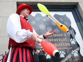 Stilt-walker Circus Jonathan juggles with his eyes closed while entertaining on Forsyth Street during Saturday's Marmora SnoFest.