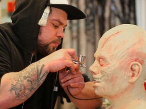 James Ferreira works on a horror mask in Winnipeg, February 2016. (Brian Donogh/Winnipeg Sun/Postmedia Network)