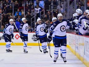 Winnipeg Jets right wing Drew Stafford (12) celebrates his second goal of the game against the Colorado Avalanche at the Pepsi Center Saturday. (Ron Chenoy-USA TODAY Sports)