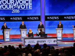 Republican presidential candidate, Sen. Marco Rubio, R-Fla., left, spars with New Jersey Gov. Chris Christie, right as Donald Trump, Sen. Ted Cruz, R-Texas, and Ben Carson listen during a Republican presidential primary debate hosted by ABC News at the St. Anselm College Saturday, Feb. 6, 2016, in Manchester, N.H. (AP Photo/David Goldman)