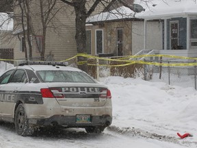 Winnipeg Police work at a crime scene in the 500 block of Stella Avenue Sunday, Feb. 7, 2016. A woman assaulted at the site the previous day was later pronounced dead in hospital. (Brian Donogh/Winnipeg Sun/Postmedia Network)