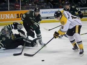 London Knights goalie Tyler Parsons and defenceman Chris Martenet scramble to stop Sarnia Sting forward Ryan McGregor from shooting the puck into the net during the Ontario Hockey League game at Budweiser Gardens on Sunday, Feb. 7, 2016 in London, Ont. The Knights and Sting face off again Saturday in Sarnia. Terry Bridge/Sarnia Observer/Postmedia Network