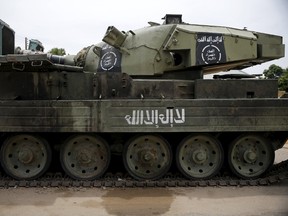 An armoured tank is seen abandoned along a road in Bazza town, after the Nigerian military recaptured it from Boko Haram, in Adamawa state May 10, 2015. REUTERS/Akintunde Akinleye